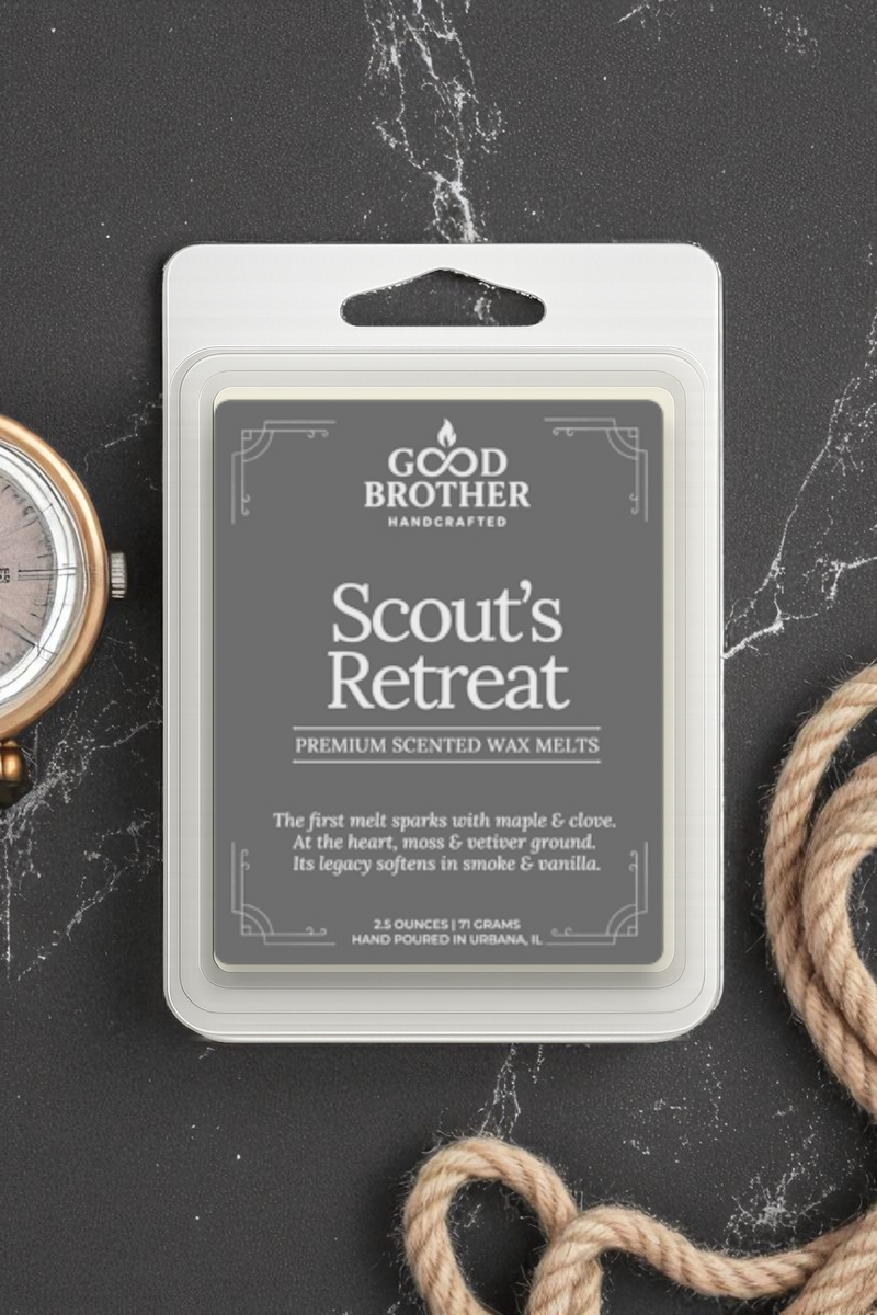 Good Brother wax melt package labeled 'Scout's Retreat' on a dark surface with rope and watch.