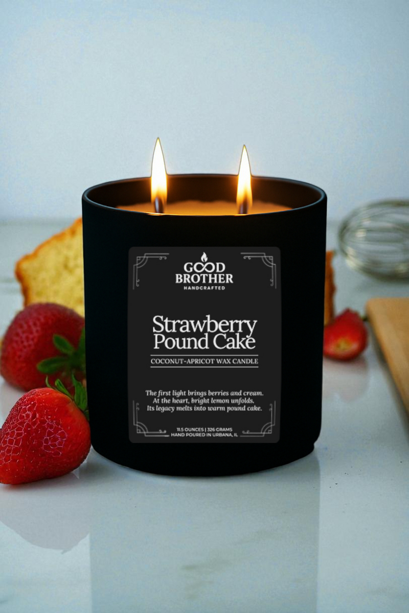 Black candle labeled 'Strawberry Pound Cake' by 'Good Brother' with strawberries and pound cake in the background.